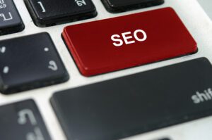 Computer keyboard with a red SEO button to illustrate Multi-Location SEO: 5 Ways to Harness its Power