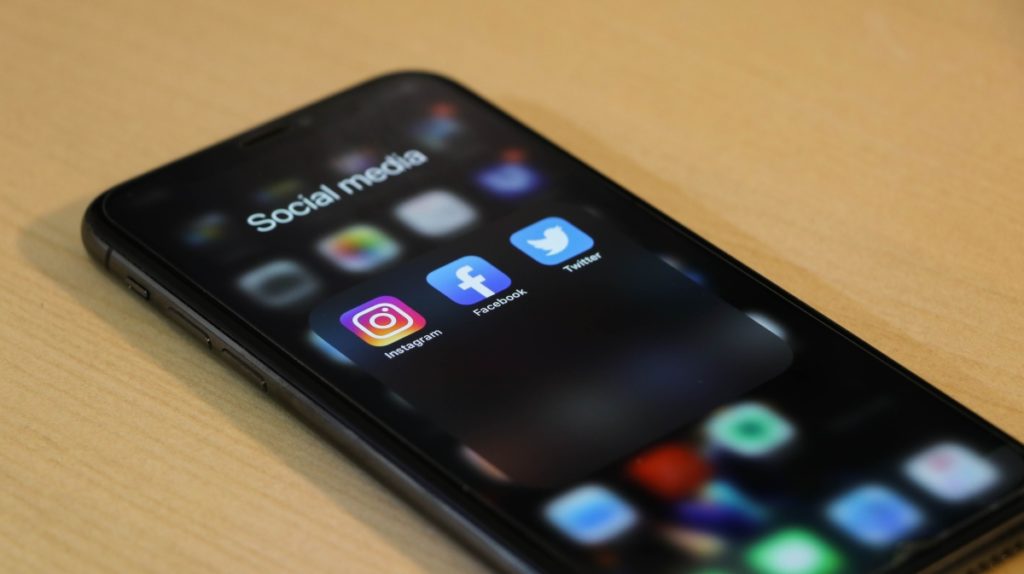Closeup of a black iPhone with social media apps