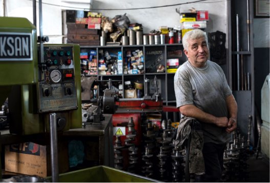 Webfor small business seo business owner in his mechanic shop