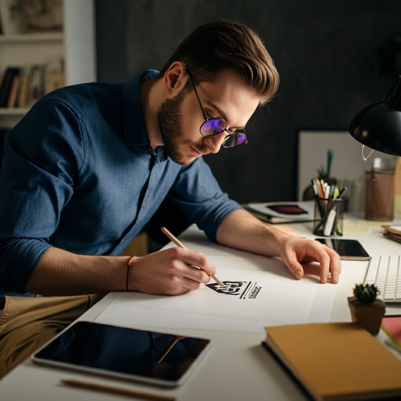 A graphic designer working on a logo.