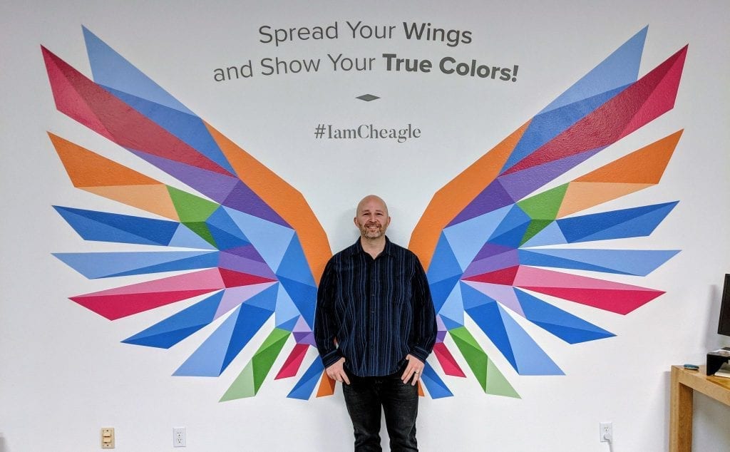 Kevin Getch in front of Webfor Mural